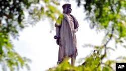 FILE - This Aug. 27, 2017, photo shows the Christopher Columbus statue at Manhattan's Columbus Circle in New York. 