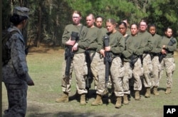 FILE - Female recruits stand at the Marine Corps Training Depot on Parris Island, South Carolina, Feb. 21, 2013.