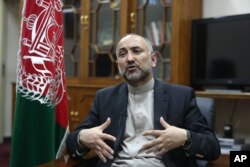 FILE - In this Oct. 24, 2015, photo, Afghan National Security Adviser Mohammad Hanif Atmar speaks during an interview with The Associated Press, in Kabul, Afghanistan.