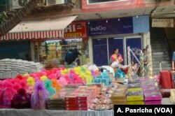 Customers flock to markets selling gifts and sweets for the Hindu festival of Diwali.