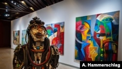 A sculpture by Cameroonian artist Joseph-Francis Sumégné titled “Mon portrait sur ton visage” is displayed at Dakar's Museum of Black Civilizations. (Photo: A. Hammerschlag/VOA)