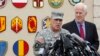 Fort Hood base commander Lieutenant General Mark Milley speaks during a news conference while flanked by U.S. Senator John Cornyn (R-TX) at the entrance to the army base in Texas April 3, 2014