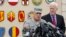 Fort Hood base commander Lieutenant General Mark Milley speaks during a news conference while flanked by U.S. Senator John Cornyn (R-TX) at the entrance to the army base in Texas April 3, 2014