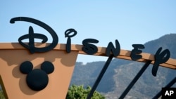 A worker inspects disposable gloves at the Top Glove factory in Shah Alam on the outskirts of Kuala Lumpur, Malaysia.