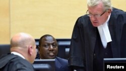 William Ruto (C) sits in the courtroom of the International Criminal Court in The Hague, May 14, 2013. 