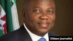 People run as dust rises after explosions hit Aden airport, upon the arrival of the newly-formed Yemeni government in Aden.