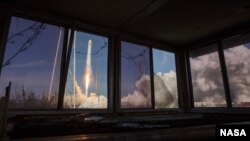 The Northrop Grumman Antares rocket, with Cygnus resupply spacecraft onboard, launches from Pad-0A, Wednesday, April 17, 2019 at NASA's Wallops Flight Facility in Virginia. 