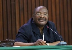 FILE - Obert Mpofu, then Zimbabwe's minister of home affairs, is pictured at a meeting in Harare, Zimbabwe, Nov. 19, 2017.
