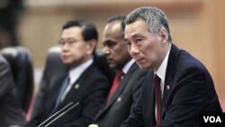 Family members of a missing passenger from the capsized passenger ferry, Sewol, wait for news of the rescue operation at a makeshift accommodation, in the port city of Jindo, April 23, 2014.