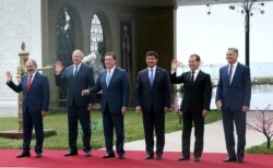 FILE - Officials pose for a picture during the Eurasian Economic Union (EEU) Council meeting, in Cholpon-Ata, Kyrgyzstan, Aug. 9, 2019.