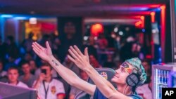 Esports star Tyler "Ninja" Blevins plays Battle Royale at the Red Bull Rise Till Dawn competition in Chicago, Illinois, on 21 July, 2018. (Joe Gall/Red Bull Content Pool via AP Images)