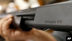 The Remington name is seen etched on a model 870 shotgun at Duke's Sport Shop in New Castle, Pa, March 1, 2018.