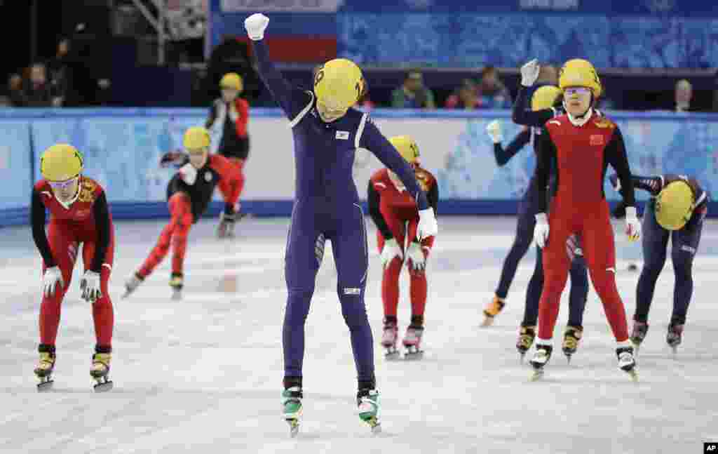 Shim Suk-Hee of South Korea celebrates her team's first place in the women's 3000m short track speedskating relay final at the Iceberg Skating Palace during the 2014 Winter Olympics, Feb. 18, 2014.