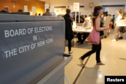 People vote in the New York primary elections at a polling station in the Brooklyn borough of New York City,April 19, 2016.