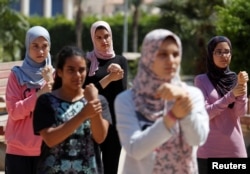 Egyptian women from Parkour Egypt "PKE" attend skills training around buildings in Cairo, July 20, 2018. Picture taken July 20, 2018. REUTERS/Amr Abdallah Dalsh