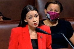 FILE - Rep. Alexandria Ocasio-Cortez, D-N.Y., speaks on the House floor on Capitol Hill in Washington, July 23, 2020.