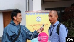 FILE - Gyaltsen Choedak, VOA Tibetan Service, is seen working at a conference in 2018. Many journalists reporting on events inside Tibet rely on messaging apps and sources who risk prison and retaliation against their families for speaking out. 