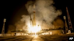 The Soyuz-FG booster rocket with the space capsule Soyuz TMA-14M is launched to the International Space Station from the Russian leased Baikonur cosmodrome, Kazakhstan, in Kazakhstan, early Thursday, July 23, 2015. 