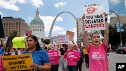 FILE - Abortion-rights supporters march in St. Louis, May 30, 2019.