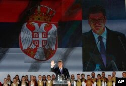 Serbian President Aleksandar Vucic waves to his supporters during a rally in the northern, Serb-dominated part of Mitrovica, Kosovo, Sept. 9, 2018.