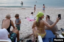 Russian tourists enjoy at Layan beach in Phuket