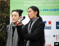 Photographer and gallery owner Rong Rong speaks at opening of Caochangdi PhotoSpring