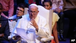 FILE - Pope Francis speaks as he meets with students of the Louvain Catholic University in Ottignies-Louvain-la-Neuve, Belgium, Sept. 28, 2024. On Saturday, he condemned Israeli airstrikes in Gaza. "This is cruelty," he said. "This is not war."