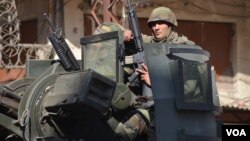 Lebanese Soldiers patrol Syria street (Jamie Dettmer/VOA) 