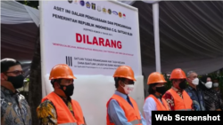 Menko Polhukam Mahfud MD dan Menteri Keuangan Sri Mulyani pada Seremoni Penguasaan Aset Eks BLBI oleh Satgas BLBI di Tangerang, Banten. (Foto: VOA)