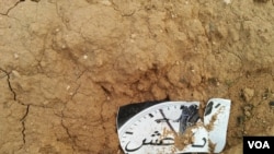 Scattered by Iraqi forces in fields and hung on light posts in Mosul, Iraq, are fliers like this one that depict IS militants' time coming to an end, using the pejorative term, Daesh to refer to the group, Jan. 21, 2017. (H.Murdock/VOA)