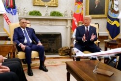 FILE - President Donald Trump meets with Iraqi Prime Minister Mustafa Kadhimi in the Oval Office of the White House, Aug. 20, 2020.