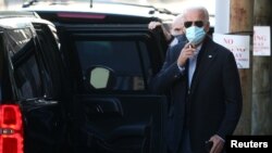 U.S. President-elect Joe Biden exits The Queen theatre following a virtual meeting with frontline healthcare workers in Wilmington, Delaware, Nov. 18, 2020.