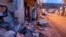 Debris of a partially collapsed house sit on the street in Fleri, Sicily, Dec. 26, 2018. 