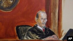 FILE - In this courtroom sketch, U.S. District Judge William H. Pauley III sentences Michael Cohen, Dec. 12, 2018, in New York. 