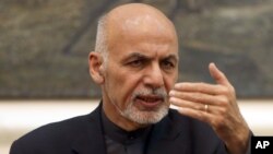 FILE - Afghan President Ashraf Ghani speaks during a press conference at the presidential palace in Kabul, Dec. 31, 2015. 