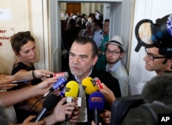 FILE - Franck Berton, the French lawyer representing Salah Abdeslam, answers questions at the Douai courthouse, northern France.