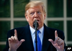 FILE - President Donald Trump speaks in the Rose Garden at the White House in Washington, Feb. 15, 2019.