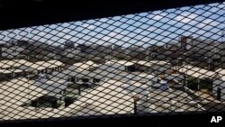 FILE - A view through a mesh window looks out over part of Aden Central Prison, known as Mansoura, in Aden, Yemen, May 9, 2017. 