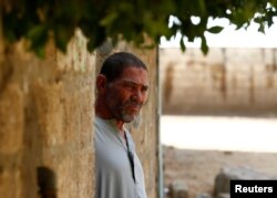 The father of Ibrahim Abushusha, a 26-year-old man who worked as a day laborer and one of at least 22 Egyptians found dead earlier this month after trekking through the Libyan desert, looks on in the village of Tarfa al-Kom in Minya province, Egypt, July 12, 2017.