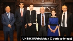 Participants watch the second presidential debate, October 9, 2016. 