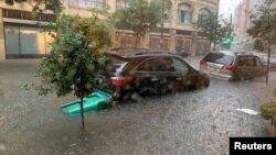 Vehicles sit in high waters after heavy rain in New Orleans, Louisiana, July 10, 2019, in this image obtained from social media.