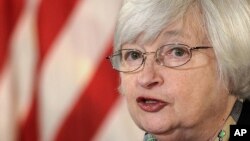 Federal Reserve Chair Janet Yellen speaks during her first news conference at the Federal Reserve in Washington, March 19, 2014. 