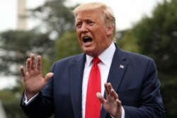 President Donald Trump speaks to members of the media on the South Lawn of the White House in Washington, Sept. 9, 2019.