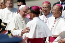 Pope Francis greets as he arrives at Military Air Terminal of Don Muang Airport, Wednesday, Nov. 20, 2019, in Bangkok, Thailand.