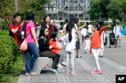 Taiwanese people enjoy their weekend, Nov. 20, 2016, at the Sun Yat-sen Memorial Hall in Taipei, Taiwan. Taiwan will soon start mandating two-day weekends for its workforce.