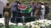 In this video frame grab, military officers remove a South African flag from Nelson Mandela's casket at his burial site in Qunu, South Africa, Sunday, Dec. 15, 2013.