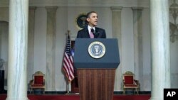 President Barack Obama makes a statement on the resignation of Egypt's President Hosni Mubarak in the Grand Foyer at the White House in Washington, February 11, 2011