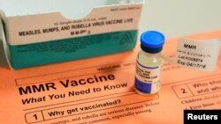 FILE - A vial of measles, mumps and rubella vaccine and an information sheet is seen at Boston Children's Hospital in Boston, Massachusetts, Feb. 26, 2015. 
