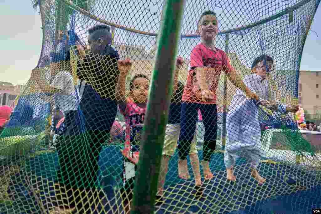 &#160; Swings for children are a common theme in front of Egypt&#39;s mosques during Eid prayers.&#160;(H. Elrasam/VOA)