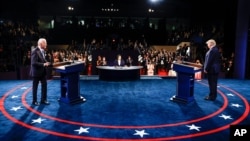 FILE - Then-President Donald Trump and then-Democratic presidential candidate former Vice President Joe Biden participate in the final presidential debate of the 2020 election campaign at Belmont University, Oct. 22, 2020, in Nashville, Tennessee.